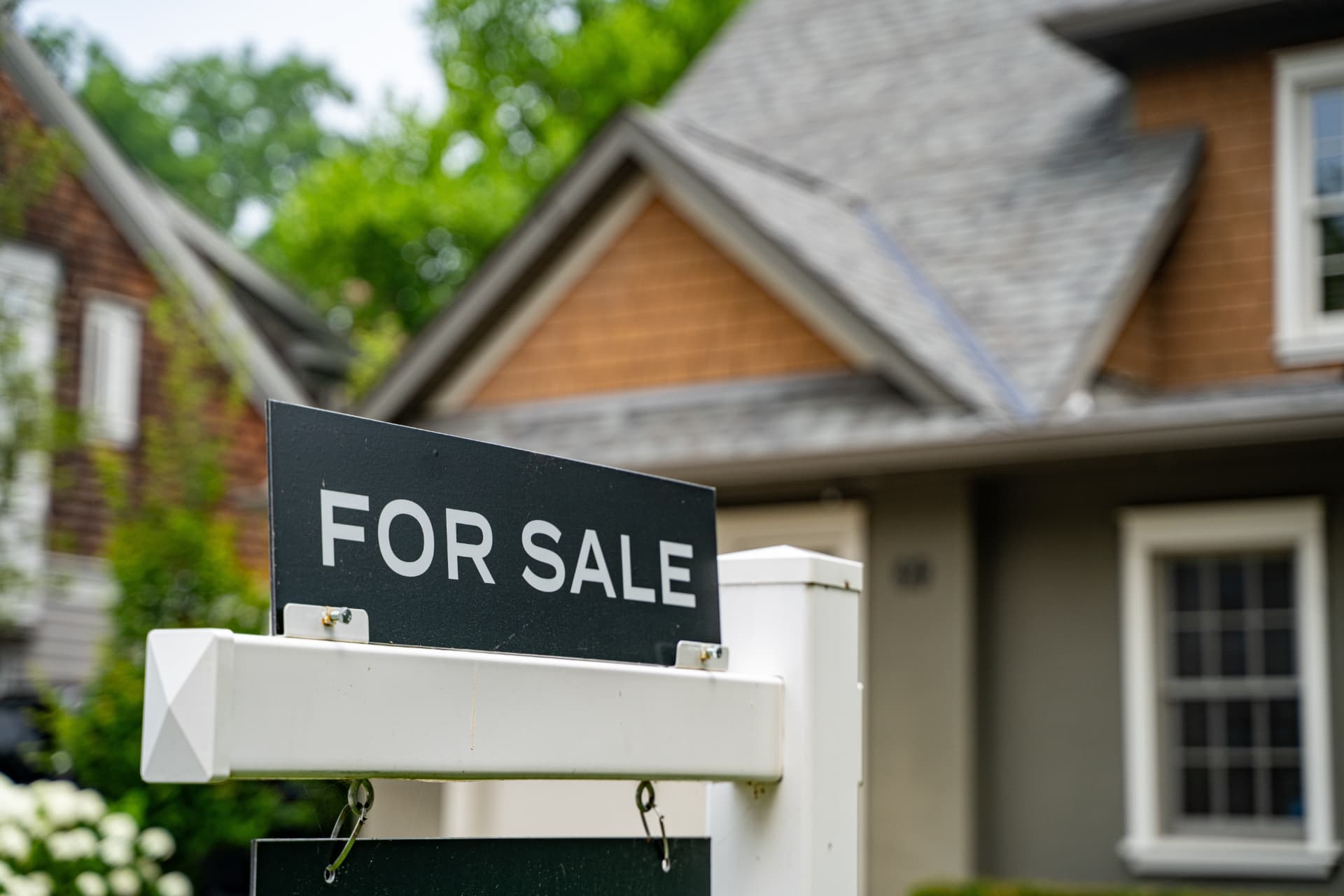 For sale sign in front of a home